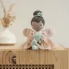 A plush fairy doll sitting on a wooden surface. Náhľad obrázku produktu
