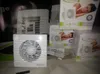 A display of bathroom fans and their packaging, with one fan unit prominently featured in the foreground. Voir les images du produit