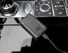 A Quad Lock wireless CarPlay adapter is shown plugged into a car's console. Náhľad obrázku produktu