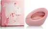 A pink perfume box and bottle are displayed side-by-side against a white background. Náhled obrázku produktu