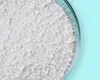 A close-up view of white granular disinfectant in a petri dish. Produktbild-Vorschau