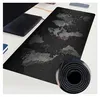 A large, black mouse and keyboard pad with a world map design is laid out on a desk. Náhled obrázku produktu