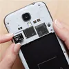 A person is inserting a microSD card into a smartphone. Anteprima dell’immagine prodotto