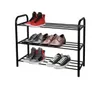 A black metal shoe rack with three shelves, holding various pairs of shoes. Náhľad obrázku produktu