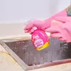 A person wearing pink gloves is spraying a cleaning product into a dirty sink. Produktbild-Vorschau