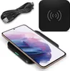 A black wireless charging pad with a smartphone on it, and a USB cable. Produktbild-Vorschau