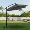 An outdoor patio scene with a gray cantilever umbrella with LED lights, two chairs, and small tables. Produktbild-Vorschau