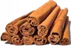 A pile of cinnamon sticks against a white background. Podgląd zdjęcia produktu