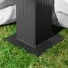 Close-up of the base of a black gazebo leg resting on grass, with a white fabric draped behind it. Produktbild-Vorschau