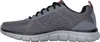 Side view of a gray athletic shoe. Voir les images du produit