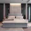 A modern bedroom with a large bed as the focal point. Produktbild-Vorschau