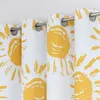 A close-up view of several hanging curtains with a yellow sun pattern on a white background. Produktbild-Vorschau