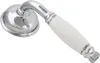 A close-up studio shot of a shower head with a white ceramic handle. Podgląd zdjęcia produktu