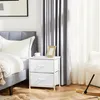 A bedroom scene with a nightstand next to a bed. Produktbild-Vorschau