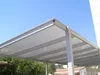 A modern carport structure with a translucent polycarbonate roof. Voir les images du produit