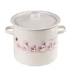 A cream-colored enamel pot with a lid, decorated with pink magnolia flowers and a purple butterfly. The word 'Magnolia' is written in cursive on the side. Produktbild-Vorschau