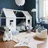 A child's bedroom with a house-shaped bed, toys, and soft furnishings. Produktbild-Vorschau