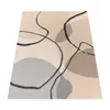 A rug with an abstract pattern is shown from a slightly elevated angle against a white background. Produktbild-Vorschau