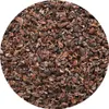 A close-up, top-down view of a pile of crushed cocoa beans. Náhled obrázku produktu