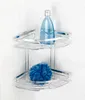A chrome corner shower caddy with two shelves, holding a blue bottle of liquid and a blue bath pouf. Produktbild-Vorschau
