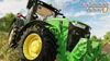 A green tractor in a field with a blue sky. Produktbild-Vorschau