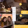 A collage of images showing a child sleeping under a blanket, two girls reading a book, and a woman sleeping, with a remote control in the center and overlay text indicating features. Produktbild-Vorschau