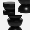 A collage of three close-up shots of a black, hourglass-shaped side table. Produktbild-Vorschau