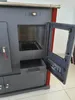A close-up view of a wood-burning stove with its door open. Produktbild-Vorschau