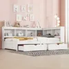 A white corner bed with built-in shelving and drawers, set against a pink wall with framed pictures and decorative items. Podgląd zdjęcia produktu