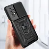 A hand holding a black smartphone case with a camera cover and a ring holder. Náhľad obrázku produktu