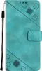 A teal flip-style phone case with a textured pattern and a wrist strap. Produktbild-Vorschau