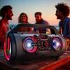 People enjoying a beach party with a portable speaker. Produktbild-Vorschau