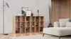 A modern living room with a wooden cube shelf filled with decorative items, a floor lamp, and a sectional sofa. Náhľad obrázku produktu