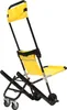 A yellow and black transport stair chair is shown against a white background. Podgląd zdjęcia produktu