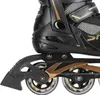 A close-up view of the wheels and frame of a black and gold inline skate. Náhľad obrázku produktu