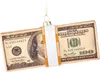 A close-up of a glass ornament shaped like a bundle of US dollar bills. Podgląd zdjęcia produktu
