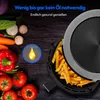 An air fryer filled with french fries, surrounded by fresh vegetables, with promotional text overlay. Produktbild-Vorschau