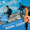 Two people hiking in a mountainous terrain with trekking poles. Produktbild-Vorschau
