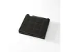 A black charcoal filter for a range hood or other appliance, viewed from a slightly elevated angle on a white background. Voir les images du produit
