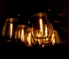 A close-up shot of several vintage-style LED light bulbs glowing warmly against a dark background. Produktbild-Vorschau