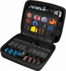 An open black dart case filled with darts and accessories. Anteprima dell’immagine prodotto