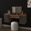 A vanity table with a mirror and drawers, along with a stool, is mounted on a black wall. Podgląd zdjęcia produktu