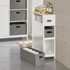 A bathroom scene with a narrow white cabinet and storage baskets. Náhled obrázku produktu
