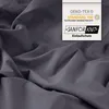 A close-up of dark gray fabric with a label indicating certifications and features. Produktbild-Vorschau