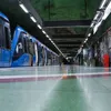 A subway station platform with a blue train. Náhľad obrázku produktu