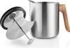 A stainless steel teapot with a wooden handle and its lid are displayed on a white background. Náhled obrázku produktu