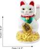 A white Maneki-neko cat figurine with a gold ingot, sitting on a pile of gold coins. Produktbild-Vorschau