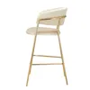 A side view of a beige bar stool with a gold metal frame, set against a white background. Produktbild-Vorschau