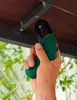 A hand holding a Bosch electric screwdriver, screwing into a wooden surface attached to a metal bracket. Produktbild-Vorschau
