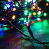 A close-up of a string of multicolor LED lights, with one red LED prominently in focus. Produktbild-Vorschau